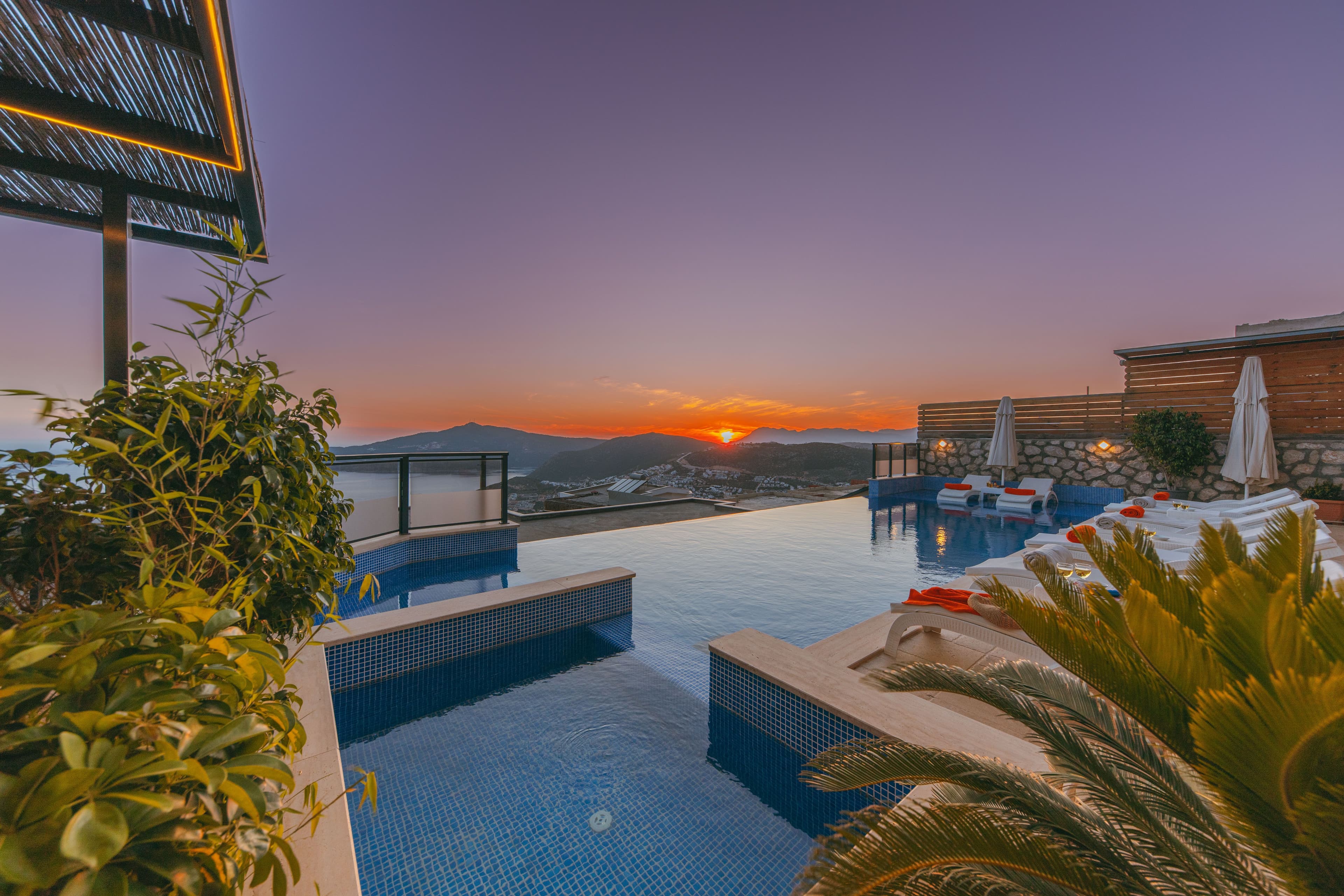 Rooftop pool glowing at sunset
